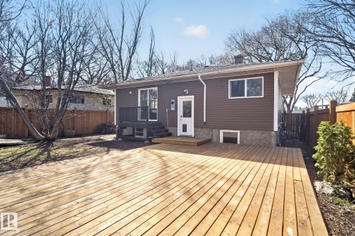 Expansive wooden deck with a natural finish, extending from the rear of the property - 10409 83 Street, Edmonton, AB - Outdoor With Deck Patio Veranda