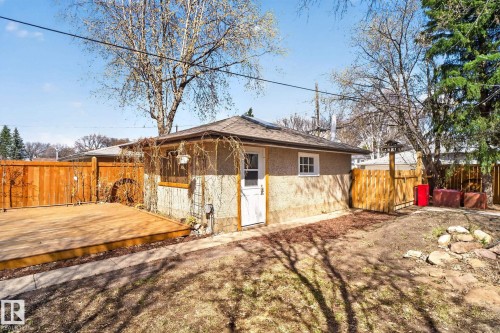 Detached auxiliary building with a private entry door, single window, and a shingled roof - 10409 83 Street, Edmonton, AB - Outdoor
