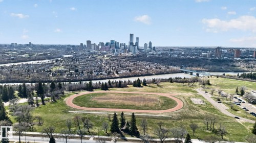 Expansive urban parkland with a distinct running track, mature trees, and a river - 10409 83 Street, Edmonton, AB - Outdoor With View