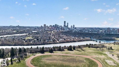 Expansive cityscape featuring a prominent river, a bridge, and a distant urban skyline - 10409 83 Street, Edmonton, AB - Outdoor With View