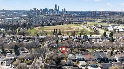 Residential street with established trees and detached homes - 10409 83 Street, Edmonton, AB - Outdoor With View