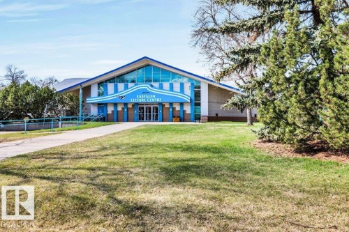 Large-scale recreational facility featuring a prominent gabled roofline and a vibrant blue and white facade - 11445 68 Street, Edmonton, AB - Outdoor