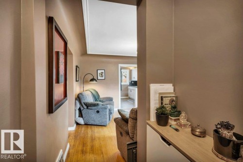 Hallway with wood-finish flooring and neutral wall tones - 11445 68 Street, Edmonton, AB - Indoor Photo Showing Other Room