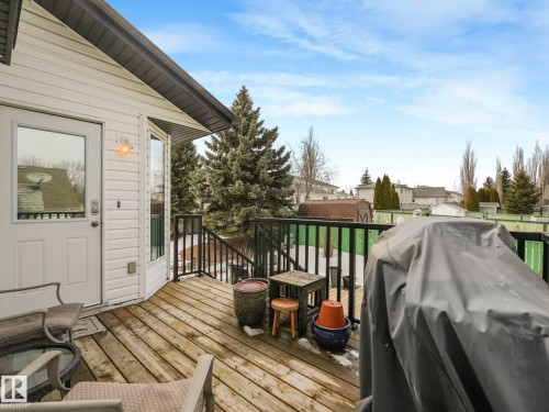 Expansive wooden deck with dark railings, offering an outdoor living area - 308 Beringer Crescent, Edmonton, AB - Outdoor With Deck Patio Veranda With Exterior