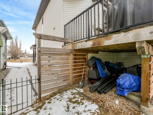 The property features a wood deck with a black metal railing and a wooden privacy screen - 308 Beringer Crescent, Edmonton, AB - Outdoor With Exterior