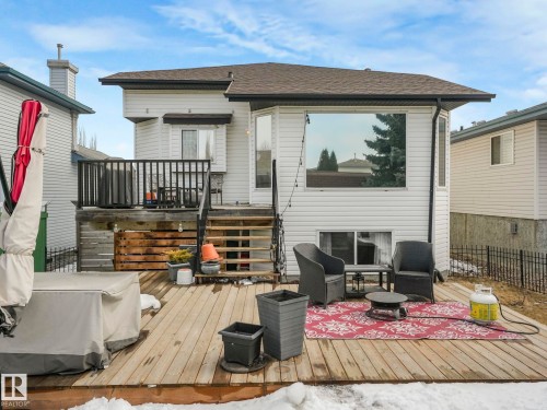The property features a spacious wooden deck with a set of wooden stairs, providing outdoor space for relaxation - 308 Beringer Crescent, Edmonton, AB - Outdoor With Deck Patio Veranda With Exterior