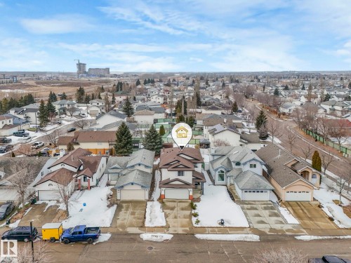 Aerial view of the property and surrounding neighborhood, showcasing the property's two-story design and attached garage - 308 Beringer Crescent, Edmonton, AB - Outdoor With View