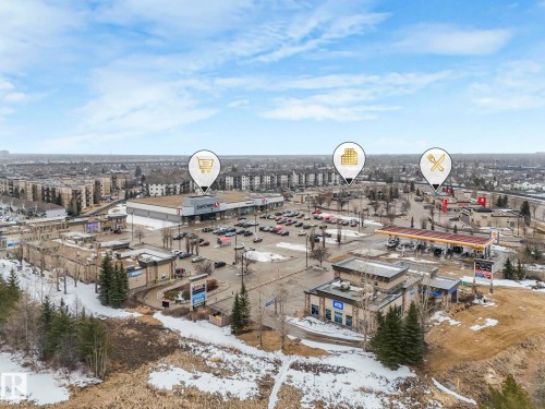 This property is situated in a vibrant commercial area, featuring a grocery store and a gas station with a convenience store - 308 Beringer Crescent, Edmonton, AB - Outdoor With View