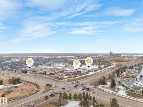 Aerial view showcasing the surrounding neighborhood, including a developed community with commercial buildings and residential areas - 308 Beringer Crescent, Edmonton, AB - Outdoor With View