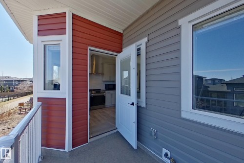 Exterior balcony featuring a concrete surface and white railing - 33 150 Everitt Dr, St. Albert, AB - Outdoor With Exterior