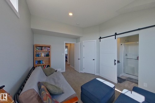 Interior room featuring light gray walls and beige carpet - 33 150 Everitt Dr, St. Albert, AB - Indoor