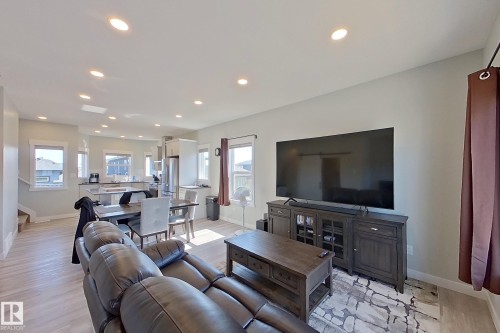 Open-concept living space featuring light wood-finish flooring and recessed lighting - 33 150 Everitt Dr, St. Albert, AB - Indoor Photo Showing Living Room
