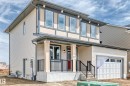 Two-story residence featuring light beige siding and dark trim accents - 1603 206 Street, Edmonton, AB  - Outdoor 