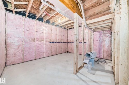 Unfinished basement space featuring exposed wood framing, insulated walls, and a concrete floor - 1603 206 Street, Edmonton, AB - Indoor Photo Showing Basement