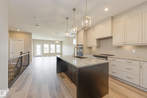 209 Stonehouse Way, Leduc, AB - Indoor Photo Showing Kitchen With Upgraded Kitchen
