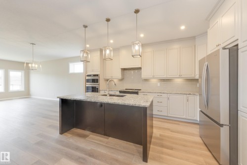 209 Stonehouse Way, Leduc, AB - Indoor Photo Showing Kitchen With Upgraded Kitchen
