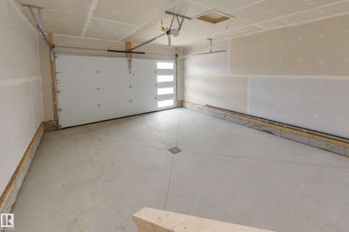 209 Stonehouse Way, Leduc, AB - Indoor Photo Showing Garage