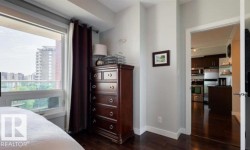 Hardwood-finish flooring throughout, complemented by light-toned wall paint and white baseboards - 