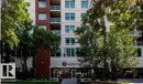 Modern multi-story building featuring a prominent street-level entrance - 702 10055 118 Street, Edmonton, AB  - Outdoor With Balcony With Facade 
