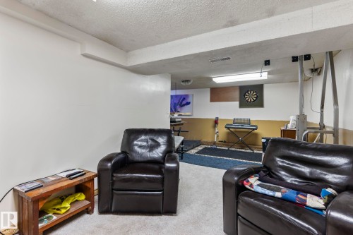 Spacious room with light-colored walls and a textured ceiling - A & B, 4858 Centre St, New Sarepta, AB - Indoor Photo Showing Other Room