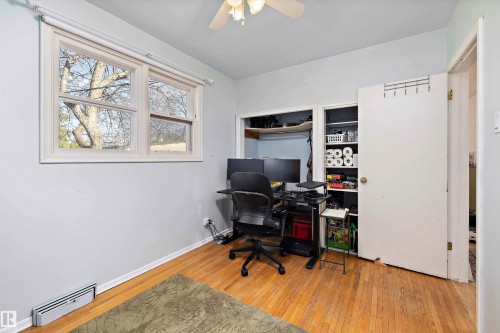 Hardwood flooring present in this room with a white window frame and window blinds - 11607 141 Street, Edmonton, AB - Indoor Photo Showing Office