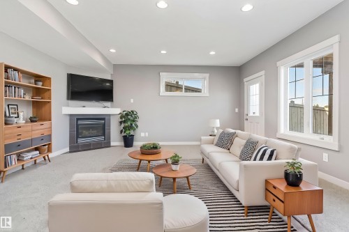3318 21A Avenue, Edmonton, AB - Indoor Photo Showing Living Room With Fireplace