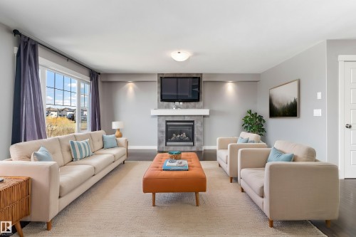 3318 21A Avenue, Edmonton, AB - Indoor Photo Showing Living Room With Fireplace
