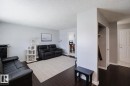 Open concept living area featuring dark wood-finish flooring, light grey painted walls, and white trim - 10325 152 Street, Edmonton, AB  - Indoor Photo Showing Living Room 