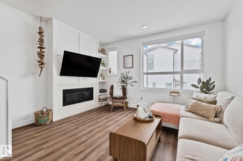 38 100 Jensen Lakes Blvd., St. Albert, AB - Indoor Photo Showing Living Room With Fireplace