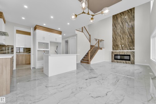 Open-concept living space with high ceilings and large format marble-look tile flooring - 12603 44 Street, Edmonton, AB - Indoor