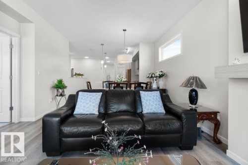 Open-concept living area featuring light wood-finish flooring and a neutral color palette - 3623 6 Street, Edmonton, AB - Indoor Photo Showing Living Room