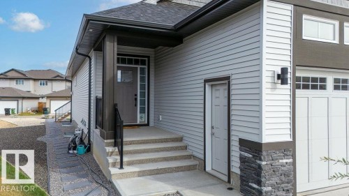 Contemporary exterior with light-toned siding and dark trim accents - 3623 6 Street, Edmonton, AB - Outdoor