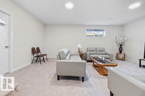 Brightly lit room featuring neutral wall paint, recessed ceiling lights, a white trim package, and light-toned carpeting - 3623 6 Street, Edmonton, AB - Indoor