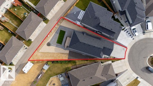 Aerial perspective showcasing the property's footprint with a long paved driveway and a landscaped rear yard - 3623 6 Street, Edmonton, AB -  With View