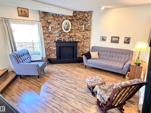 10248 109 Avenue, Westlock, AB - Indoor Photo Showing Living Room With Fireplace