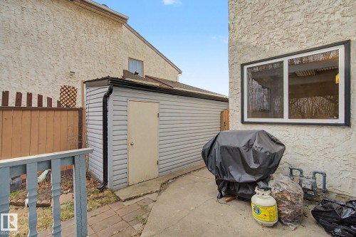 Detached storage shed with sloped roof and side entry door - 17305 60 Ave, Edmonton, AB 