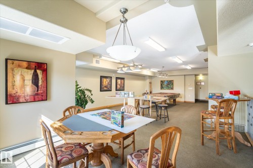 Recreational room featuring a pool table, a card table, and various light fixtures - 104 612 111 Street Sw, Edmonton, AB - Indoor Photo Showing Dining Room