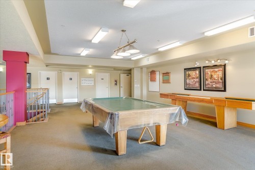 Recreation room featuring a pool table, shuffleboard table, and carpeted flooring - 104 612 111 Street Sw, Edmonton, AB - Indoor Photo Showing Other Room