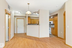 The property features light wood flooring throughout the main living areas - 