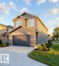 Contemporary two-story residence featuring vertical siding and stone accents - 53 Mockingbird Cres, Fort Saskatchewan, AB  - Outdoor 
