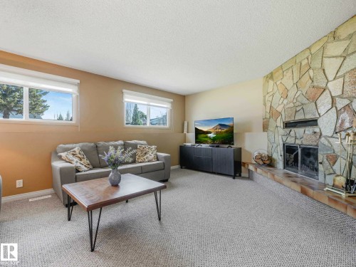 6011 37 Avenue, Edmonton, AB - Indoor Photo Showing Living Room With Fireplace