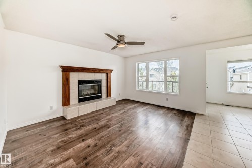 54 Royal Elm Road Nw, Calgary, AB - Indoor Photo Showing Living Room With Fireplace
