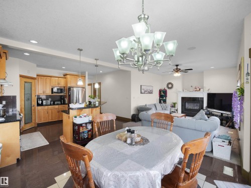1015 61 Street, Edmonton, AB - Indoor Photo Showing Dining Room With Fireplace