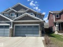 Modern multi-story property featuring a stone facade and siding exterior - 871 Ebbers Crescent, Edmonton, AB  - Outdoor With Facade 