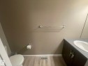 Bathroom featuring a dark wood-finish vanity with an integrated sink and grey countertop - 871 Ebbers Crescent, Edmonton, AB  - Indoor Photo Showing Bathroom 