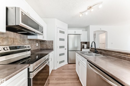 115 Keystone Lane, Leduc, AB - Indoor Photo Showing Kitchen With Stainless Steel Kitchen With Double Sink With Upgraded Kitchen