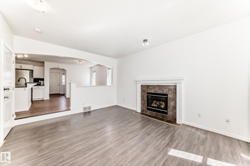 115 Keystone Lane, Leduc, AB - Indoor Photo Showing Living Room With Fireplace