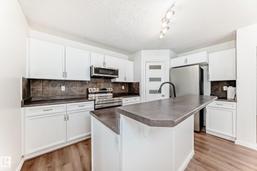 115 Keystone Lane, Leduc, AB - Indoor Photo Showing Kitchen With Stainless Steel Kitchen