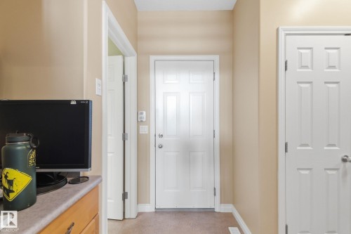 Entryway with neutral wall paint, white trim, and a carpeted floor - 30 Valleyview Ridge, Fort Saskatchewan, AB - Indoor Photo Showing Other Room