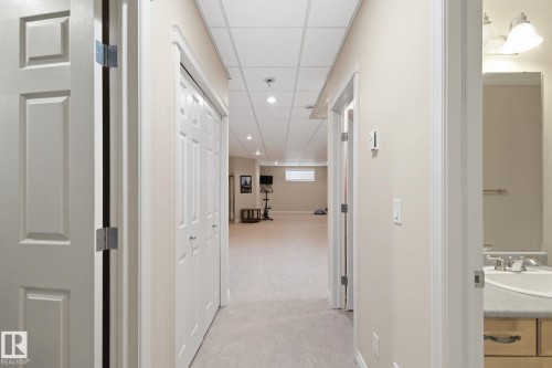 Hallway with recessed lighting and neutral-toned walls - 30 Valleyview Ridge, Fort Saskatchewan, AB - Indoor